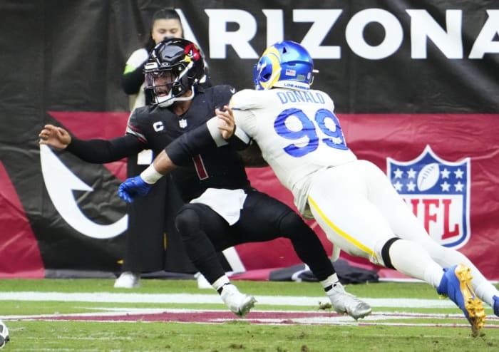 Nov. 26, 2023; Arizona Cardinals quarterback Kyler Murray (1) is sacked by Los Angeles Rams defensive tackle Aaron Donald (99). © Rob Schumacher/The Republic / USA TODAY NETWORK